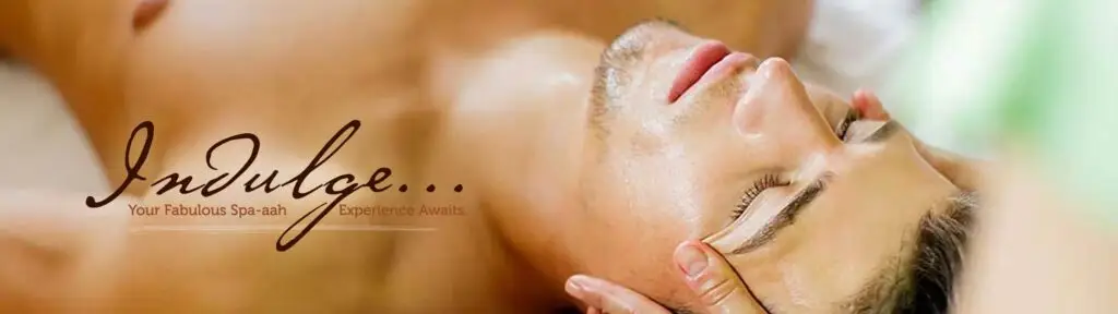 Close-up of a man receiving a facial massage.