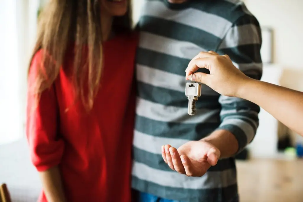 couple being handed keys