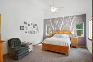 Bedroom with tree mural and photo wall. - 9018