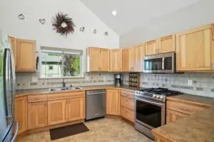 Bright kitchen with wooden cabinets and modern appliances.